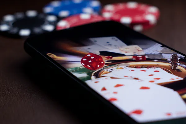 A glamorous woman holding casino chips in a neon-lit environment, representing the premium online casino atmosphere of TK99.